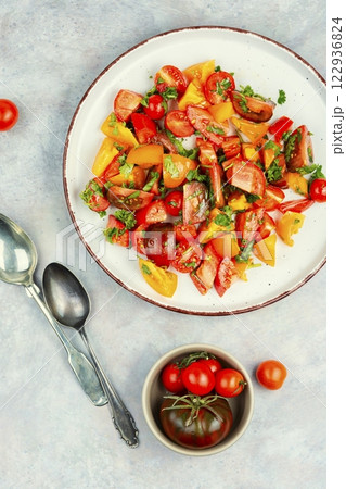 Delicious vegetable salad with fresh tomatoes. 122936824