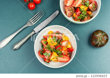 Salad of multi-colored tomatoes. 122936825