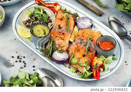 Uncooked salmon fillet. 122936832