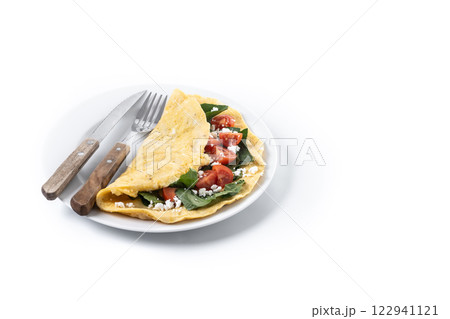 Stuffed omelette with tomatoes and spinach isolated on white background Stuffed omelette with tomatoes and spinach isolated on white background 122941121