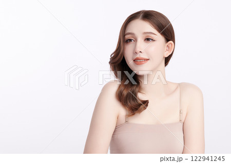 Beautiful young asian woman with clean fresh skin on white background, Face care, Facial treatment, Cosmetology, beauty and spa, Asian women portrait. Beautiful young asian woman with clean fresh skin on white background, Face care, Facial treatment, Cosmetology, beauty and spa, Asian women portrait. 122941245
