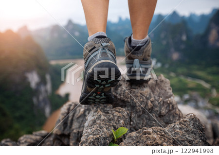 Climbing to the top of mountain and enjoy beautiful landscape of yangshuo county, China Climbing to the top of mountain and enjoy beautiful landscape of yangshuo county, China 122941998