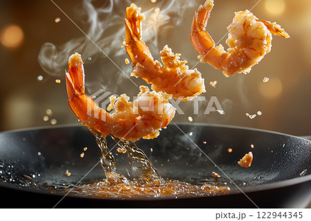 Golden-Brown Fried Prawns Leaping From Frying Pan in Action Shot 122944345