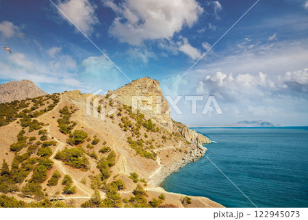 Rocky sea coast. Wilde beach. Rocky bay Rocky sea coast. Wilde beach. Rocky bay 122945073