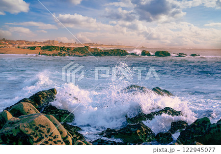 Atlantic ocean rocky beach in the evening. Porto, Portugal 122945077
