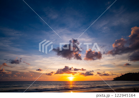 Amazing colorful clouds in sunset or sunrise sky over sea nature landscape background Amazing colorful clouds in sunset or sunrise sky over sea nature landscape background 122945164