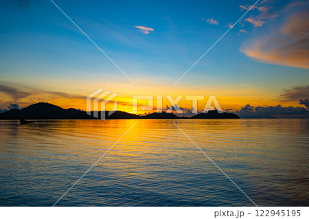 Landscape of colorful clouds in sunset or sunrise sky over sea with reflection in the tropical sea,Beautiful seascape scenery,Amazing light of nature Landscape nature background 122945195
