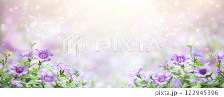 Purple Petunia Flowers In Bloom With Green Leaves And Dreamy Background 122945396