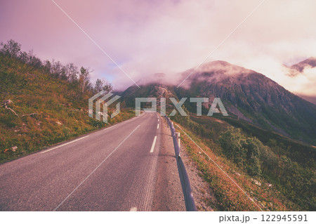 Driving a car on the road on Senja Island. View from the windshield. Norway, Europe 122945591