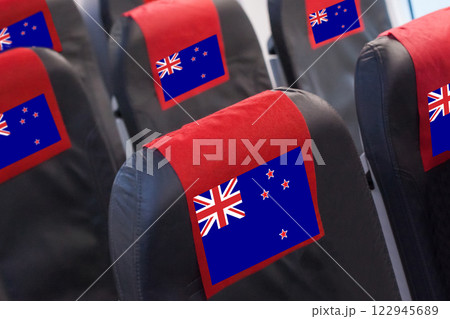 New Zealand Flag on Empty seat in plane. Travel, flight and transportration concept New Zealand Flag on Empty seat in plane. Travel, flight and transportration concept 122945689