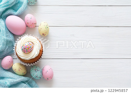 Easter cupcake decorated with easter egg on white marble background. Top view. Copy space 122945857