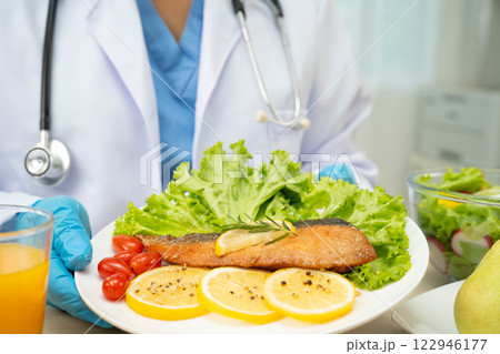 Asian Nutritionist holding healthy food for patient in hospital, nutrition and vitamin. Asian Nutritionist holding healthy food for patient in hospital, nutrition and vitamin. 122946177