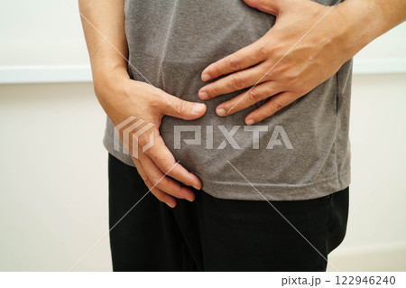 Hernia, Asian man stomach ache, abdominal pain and urology problem health. 122946240