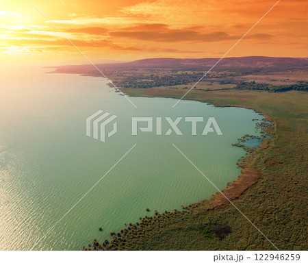 View from above of Tihany peninsula and Balaton lake during sunset View from above of Tihany peninsula and Balaton lake during sunset 122946259