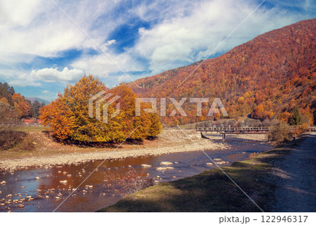 Mountain river with a rocky shore. Beautiful natural landscape Mountain river with a rocky shore. Beautiful natural landscape 122946317