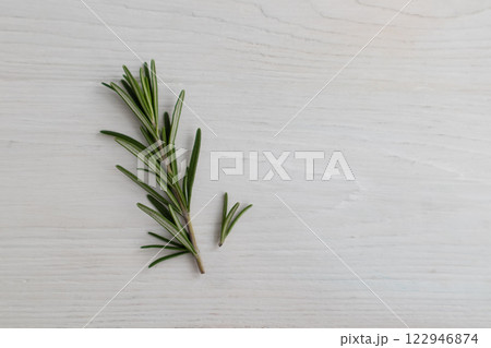 Sprigs of rosemary on a white background with space for text. Layout, template. 122946874