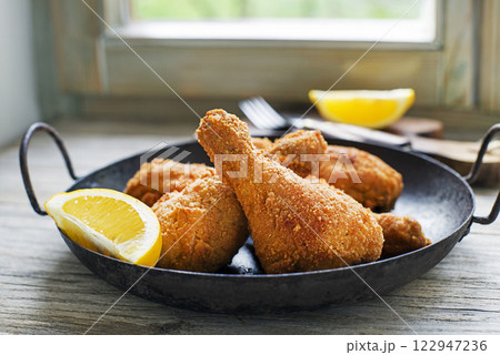 Fried chicken drumstick 122947236