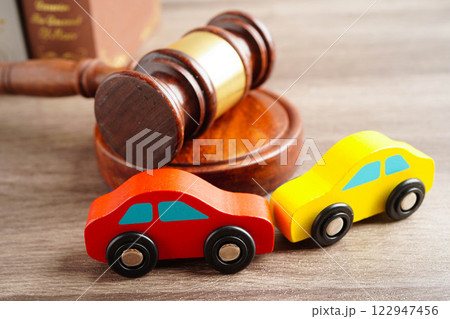 Car accident lawsuit and insurance, Judge hammer with car model. 122947456