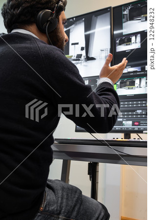 Security guard watching video monitoring surveillance security system Security guard watching video monitoring surveillance security system 122948232