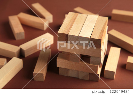 Blocks of wood on brown background, Strategy game as a business plan for team work 122949484