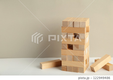 Blocks of wood on grey background, Strategy game as a business plan for team work Blocks of wood on grey background, Strategy game as a business plan for team work 122949486
