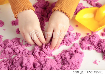 Kids creativity. Kinetic sand games for child development at home. Sand therapy. Children's hands making starfish. 122949506