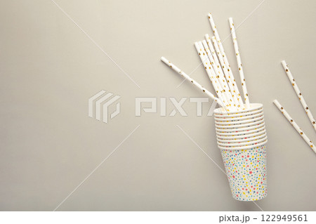 Photo of cups drink cocktail party tubules on the grey background with blank space. 122949561