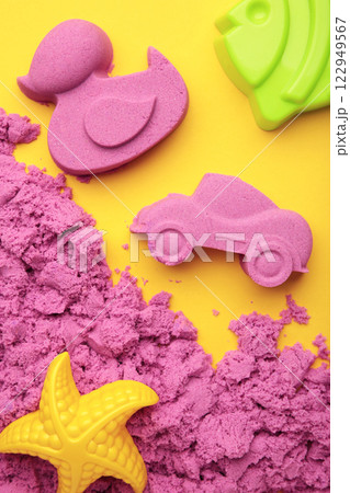 Pink kinetic sand for children, development and play at home with multi-colored sandbox molds Pink kinetic sand for children, development and play at home with multi-colored sandbox molds 122949567