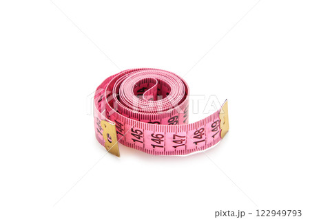 Pink plastic measure tape with metric scale isolated on white background. Pink plastic measure tape with metric scale isolated on white background. 122949793