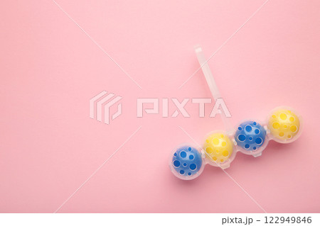 Toilet cleaner on pink background. Toilet balls 122949846