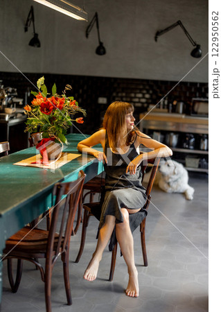 Relaxed Woman in a Modern Kitchen 122950562