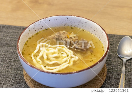Close up shot of the of the mud bowl with the soup Close up shot of the of the mud bowl with the soup 122951561
