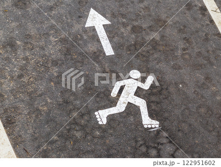 Shot of the paint marking on the asphalt indicating roller skating path 122951602