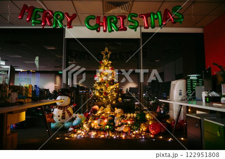 Nativity Scene with Christmas Tree and Balloon Decorations in Office Festive Atmosphere with Santa Claus. High quality photo Nativity Scene with Christmas Tree and Balloon Decorations in Office Festive Atmosphere with Santa Claus. High quality photo 122951808
