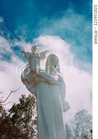 Vung Tau Beach with Blue Sky Flowers and Mother Mary Statue Scenic Coastal View with Coffee Shop Nearby High quality photo Vung Tau Beach with Blue Sky Flowers and Mother Mary Statue Scenic Coastal View with Coffee Shop Nearby High quality photo 122951825