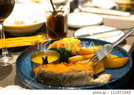 Elegant Restaurant with Steak, Bread, and Wine Perfect Setting for a Party and Fine Dining Experience. High quality photo Elegant Restaurant with Steak, Bread, and Wine Perfect Setting for a Party and Fine Dining Experience. High quality photo 122951848