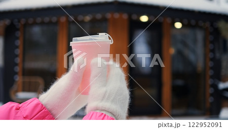 Bright pink cup against glowing winter backdrop evokes cozy moment of relaxation, letting cozy thoughts warm chilly day, as cozy ambiance invites viewers to embrace gentle calm forever. Bright pink cup against glowing winter backdrop evokes cozy moment of relaxation, letting cozy thoughts warm chilly day, as cozy ambiance invites viewers to embrace gentle calm forever. 122952091