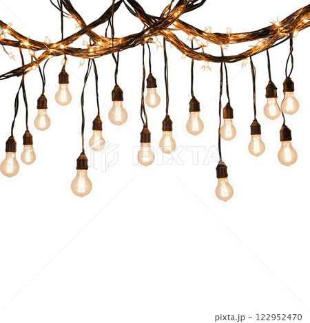 Decorative warm lights hanging in a creative arrangement for evening outdoor ambiance 122952470