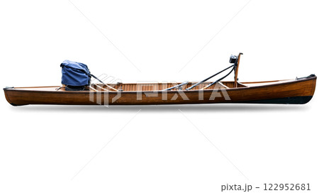 A wooden canoe with a blue cover and motor resting on a white background 122952681