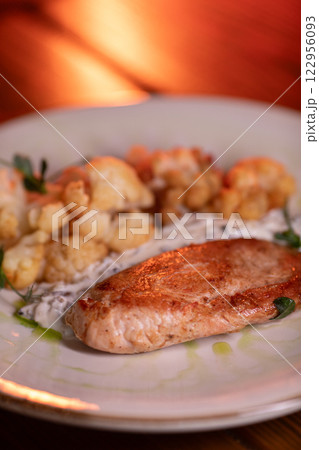 Baked turkey and cauliflower are a delicious dish 122956093