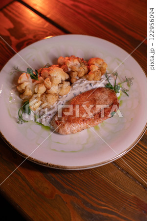 Baked turkey and cauliflower are a delicious dish 122956094