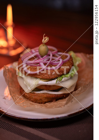 Juicy burger made from draniki and meat patties 122956154