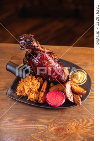 Juicy baked pork knuckle served beautifully on a 122956221