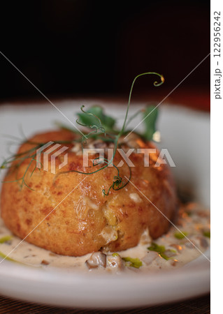 Delicious cutlets with airy mashed potatoes served Delicious cutlets with airy mashed potatoes served 122956242