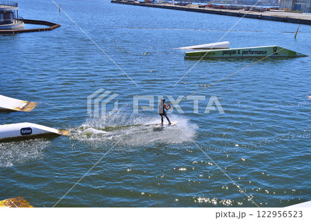 Man wakeboarding in front of modern residential neighborhood at Aarhus in Denmark 122956523