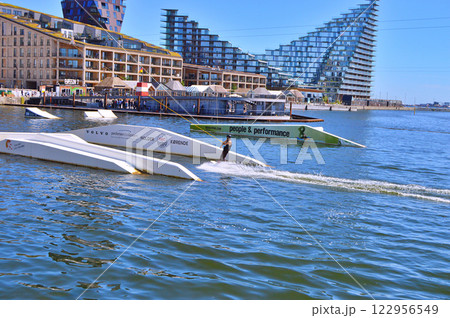 Man wakeboarding in front of modern residential neighborhood at Aarhus in Denmark 122956549