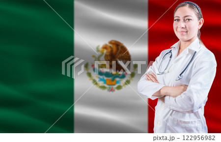 Female doctor on Mexico flag. Doctor with crossed arms on Mexico flag. Mexico Health and Care concept Female doctor on Mexico flag. Doctor with crossed arms on Mexico flag. Mexico Health and Care concept 122956982