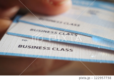 Holding multiple business class boarding passes in hand Holding multiple business class boarding passes in hand 122957738