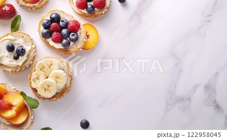 Classic American And European Summer Breakfast: Toast Sandwiches With Peanut Butter And Assorted Berries On A White Marble Table. Top View With Copy Space. Classic American And European Summer Breakfast: Toast Sandwiches With Peanut Butter And Assorted Berries On A White Marble Table. Top View With Copy Space. 122958045