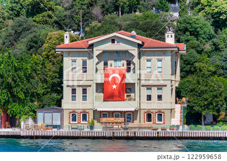 Green mountains of the Asian side of Bosphorus strait, with traditional house and dense trees in a summer day 122959658